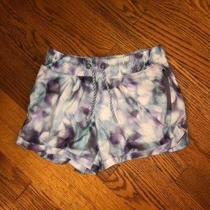 Athleta Girl tie dye blue and purple shorts.